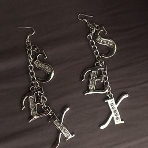 Selling these SEX earrings by monirath. Brand new